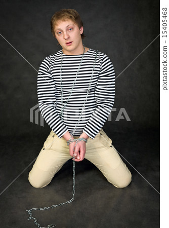 Young man shackled 15405468