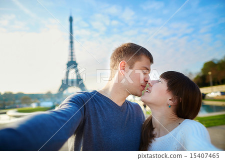 Tourists taking selfie near the Eiffel tower Tourists taking selfie near the Eiffel tower 15407465