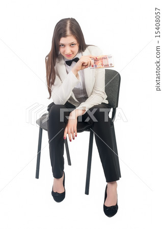 Pretty businesswoman with roubles sits on chair 15408057