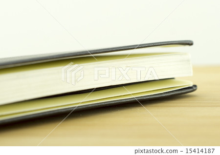 open book with incident light from the side on des open book with incident light from the side on des 15414187