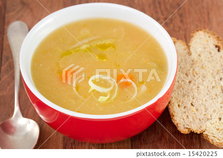 vegetable soup in red bowl 15420225