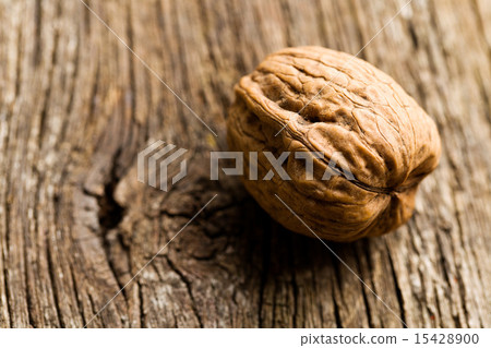 walnut on old wooden table walnut on old wooden table 15428900
