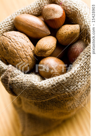 Various nuts in jute bag Various nuts in jute bag 15428903