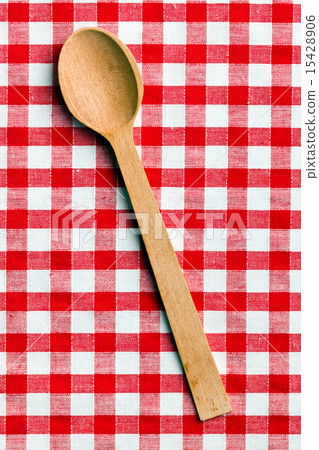wooden spoon on checkered tablecloth wooden spoon on checkered tablecloth 15428906