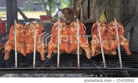 Roast chicken on grill 15428992
