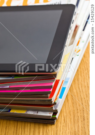 touch tablet and magazines 15429129