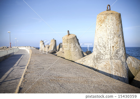 Sea pier and concrete block breakwaters. Sea pier and concrete block breakwaters. 15430359
