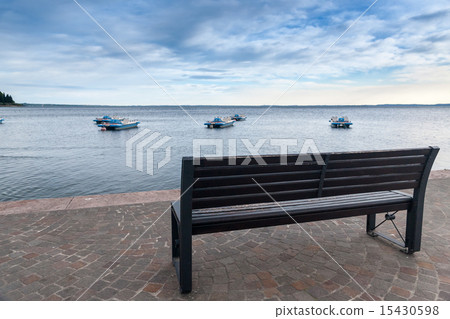 Wood bench at the Garda lake Wood bench at the Garda lake 15430598