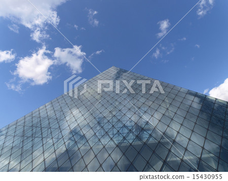 Glass pyramid and blue sky and clouds Glass pyramid and blue sky and clouds 15430955