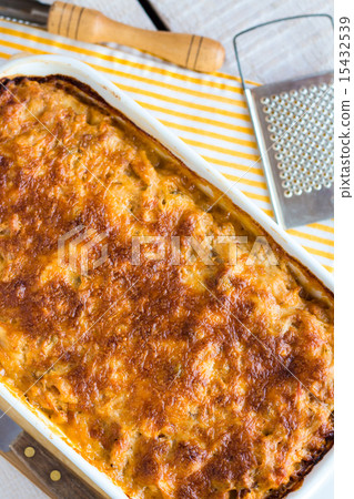 meat lasagna with mushrooms in a white bowl  15432539