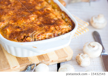 meat lasagna with mushrooms in a white bowl  15432543