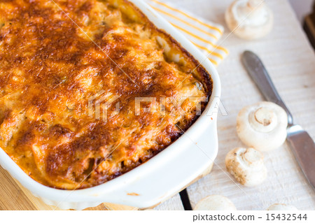 meat lasagna with mushrooms in a white bowl  meat lasagna with mushrooms in a white bowl  15432544