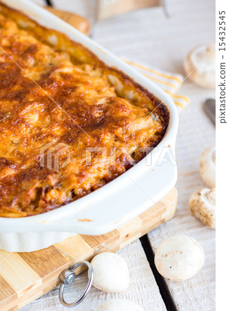 meat lasagna with mushrooms in a white bowl  15432545