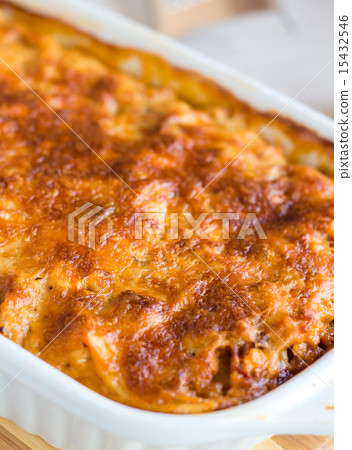 meat lasagna with mushrooms in a white bowl  15432546