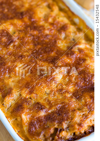 meat lasagna with mushrooms in a white bowl  15432548