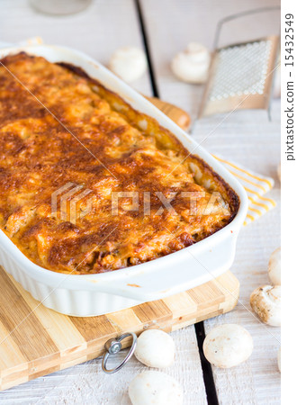 meat lasagna with mushrooms in a white bowl  15432549