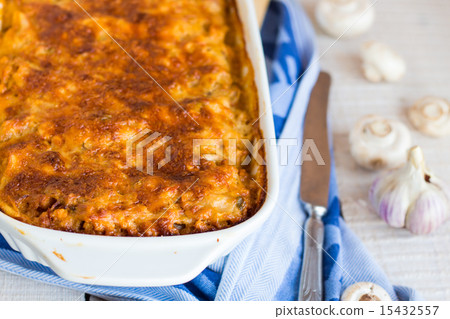 meat lasagna with mushrooms in a white bowl 15432557