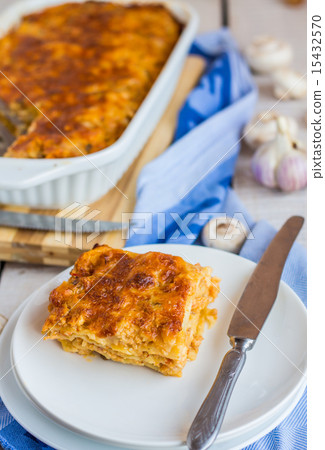 piece of meat lasagna with mushrooms on a plate 15432570