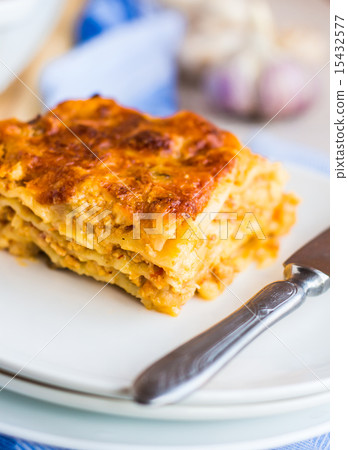 piece of meat lasagna with mushrooms on a plate piece of meat lasagna with mushrooms on a plate 15432577