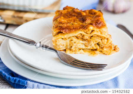 piece of meat lasagna with mushrooms on a plate piece of meat lasagna with mushrooms on a plate 15432582