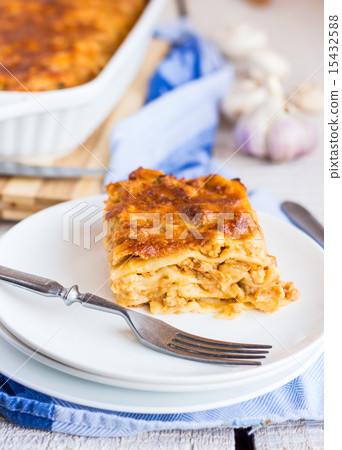 piece of meat lasagna with mushrooms on a plate 15432588