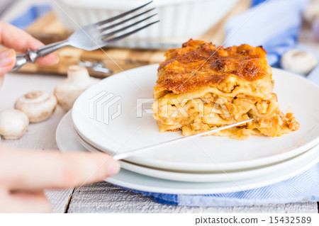 piece of meat lasagna with mushrooms on a plate 15432589