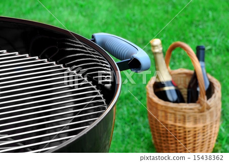 BBQ Grill On The Lawn And Basket With Champagne BBQ Grill On The Lawn And Basket With Champagne 15438362