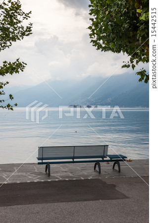 lonely bench overlooking the lake Maggiore 15442515