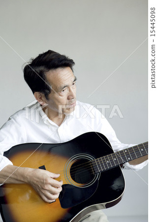 A man who plays a guitar A man who plays a guitar 15445098