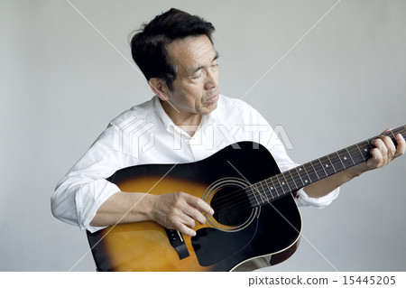 A man who plays a guitar A man who plays a guitar 15445205