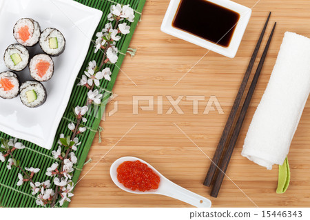 Sushi maki set with fresh sakura branch Sushi maki set with fresh sakura branch 15446343