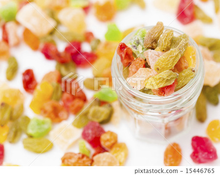 Dried fruit overflowing from a small bottle (overhead view) Dried fruit overflowing from a small bottle (overhead view) 15446765