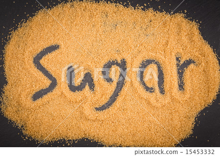 word sugar written in brown granulated sugar 15453332