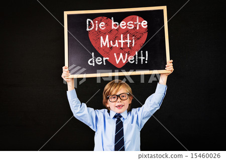 Composite image of cute pupil holding chalkboard Composite image of cute pupil holding chalkboard 15460026