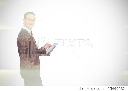 Composite image of happy businessman using his tablet pc Composite image of happy businessman using his tablet pc 15460682