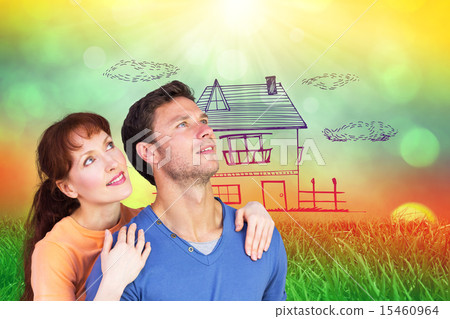 Composite image of happy couple looking upwards 15460964