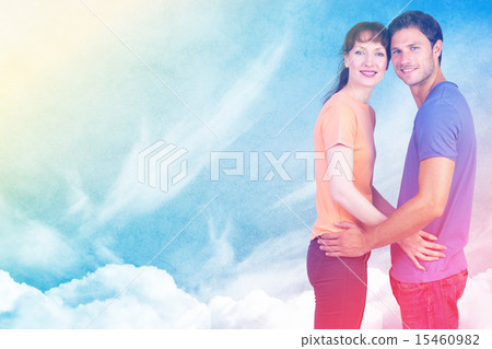 Composite image of couple looking at the camera 15460982