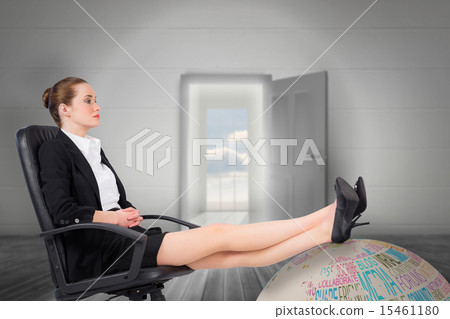 Composite image of businesswoman sitting on swivel chair with fe 15461180