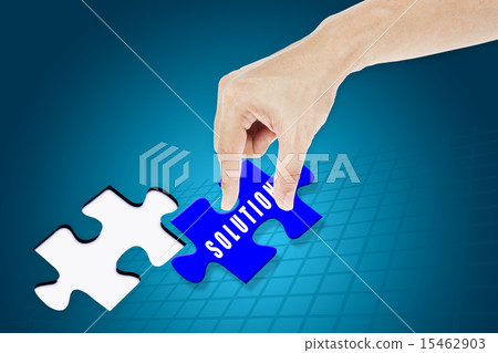 Hand inserting missing solution jigsaw puzzle Hand inserting missing solution jigsaw puzzle 15462903
