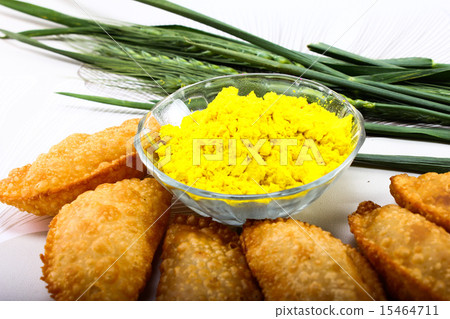 gujia in plate with holi green color in bowl 15464711