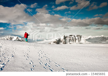 Man climbs on a snow slope Man climbs on a snow slope 15465691