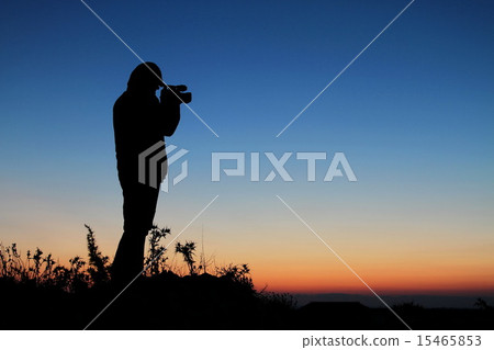 The Cameraman, Silhouette of Man with Video Camera 15465853