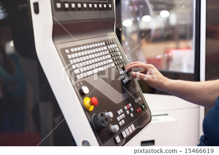 Man working at programmable machine Man working at programmable machine 15466619