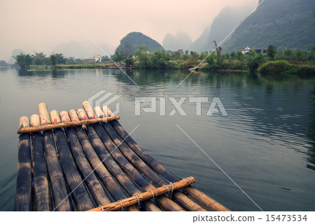 China Guilin Yangshuo bamboo rafting in the beautiful "Yulong River". China Guilin Yangshuo bamboo rafting in the beautiful "Yulong River". 15473534