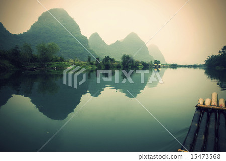 China Guilin Yangshuo bamboo rafting in the beautiful "Yulong River" 15473568