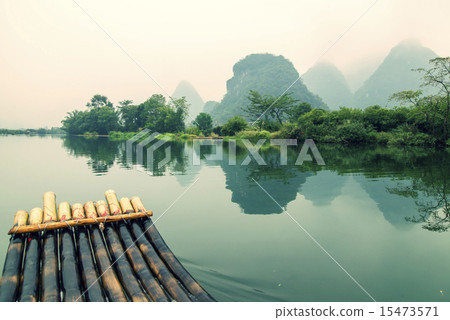 China Guilin Yangshuo bamboo rafting in the beautiful "Yulong River" China Guilin Yangshuo bamboo rafting in the beautiful "Yulong River" 15473571