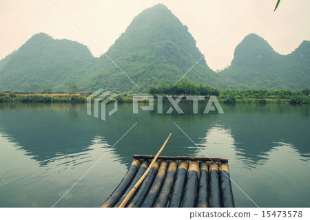 China Guilin Yangshuo bamboo rafting in the beautiful "Yulong River" China Guilin Yangshuo bamboo rafting in the beautiful "Yulong River" 15473578