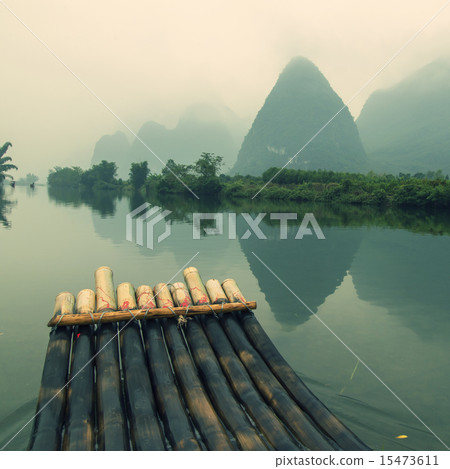 China Guilin Yangshuo bamboo rafting in the beautiful "Yulong River" China Guilin Yangshuo bamboo rafting in the beautiful "Yulong River" 15473611