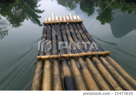 China Guilin Yangshuo bamboo rafting in the beautiful "Yulong River" China Guilin Yangshuo bamboo rafting in the beautiful "Yulong River" 15473630