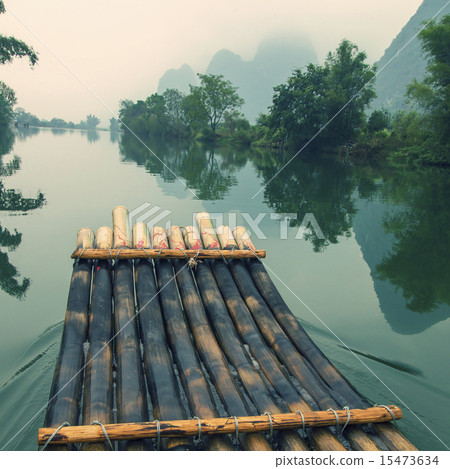 China Guilin Yangshuo bamboo rafting in the beautiful "Yulong River" China Guilin Yangshuo bamboo rafting in the beautiful "Yulong River" 15473634